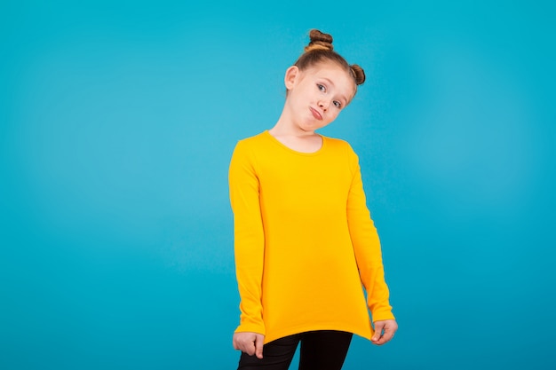 A little pretty girl wearing yellow shirt