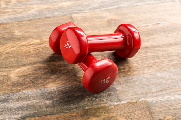 Little red dumbbells on the floor