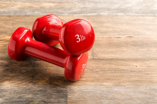 Photo little red dumbbells on the floor