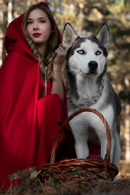 Little red riding hood with adorable husky