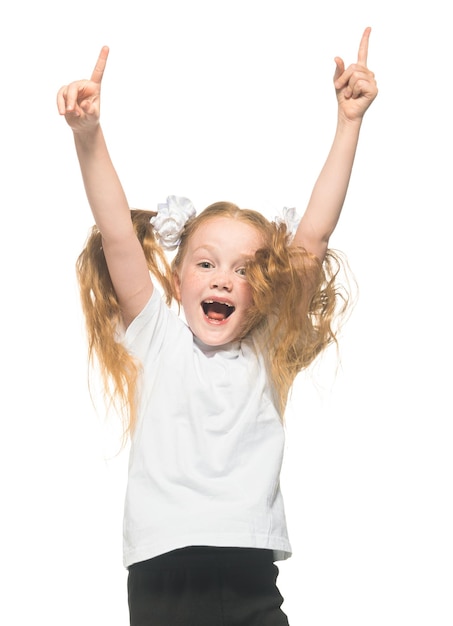 Little redhead girl on isolated white background studio light clipping cut out