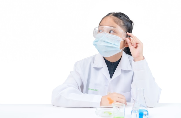 A little scientist is thinking  isolated on white background. science experiment and education concept