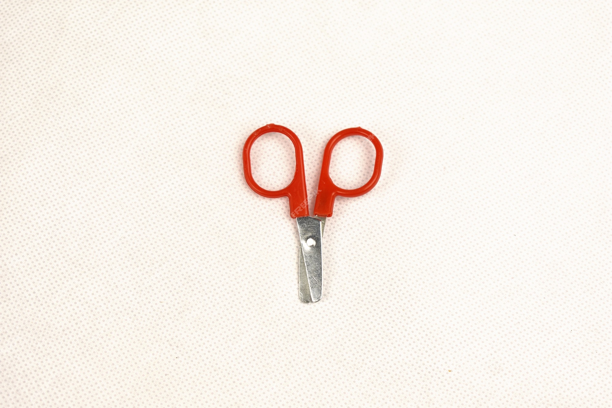 Premium Photo  Little scissors on a white background