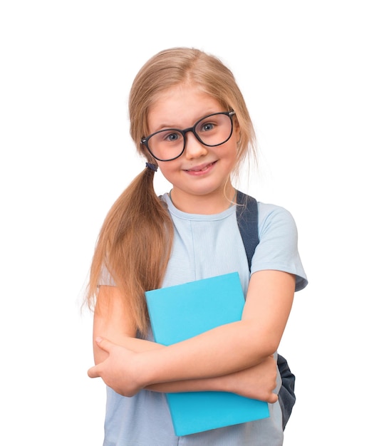 Little smiling preschooler girl student in eyeglasses holding bookisolated on white background