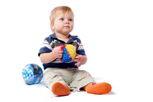 Little toddler plays with loved toy