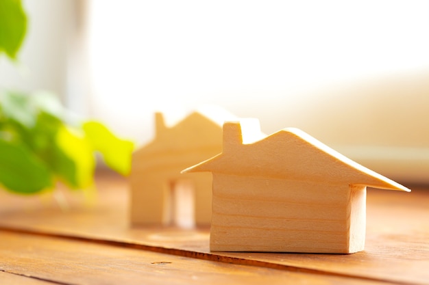 Little toy house model carved from wood close up