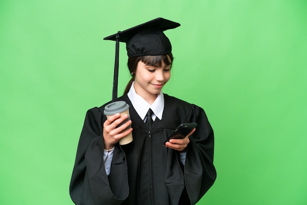 Little university girl over isolated background holding coffee to take away and a mobile