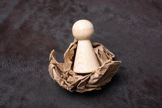 Little wooden man figurine in view