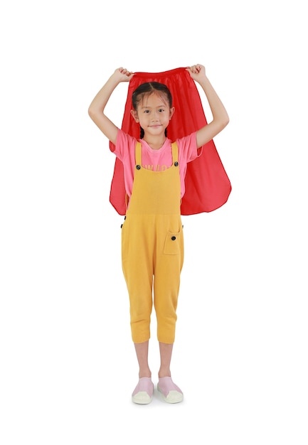 Little young girl wearing red shawl isolated over white background. Kid play superhero concept