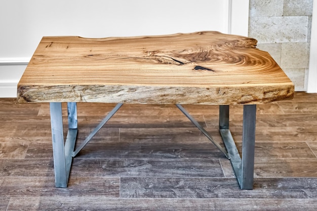 Live edge elm slab coffee table with bizarre pattern shape and tree rings on metal base