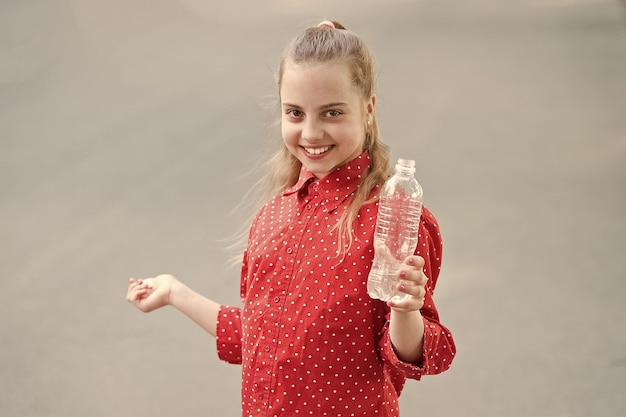 Live healthy life healthy and hydrated girl care about health
and water balance girl cute cheerful hold water bottle water
balance concept drink water during summer walk make one more
sip