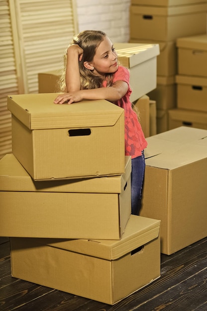 Live like you want happy child cardboard box happy little girl\
purchase of new habitation moving concept new apartment cardboard\
boxes moving to new house