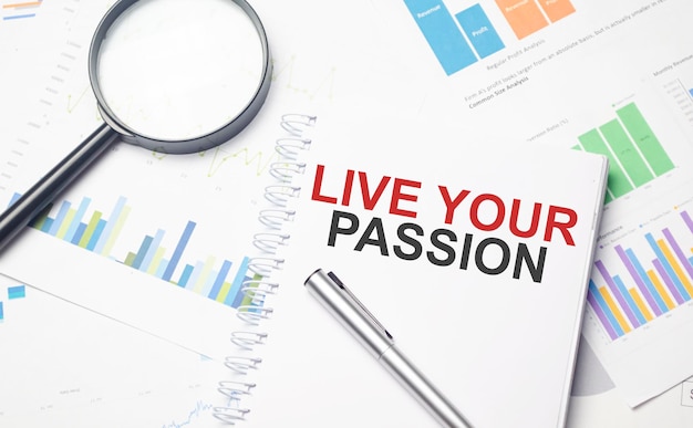 LIVE YOUR PASSION words on labels with document binders