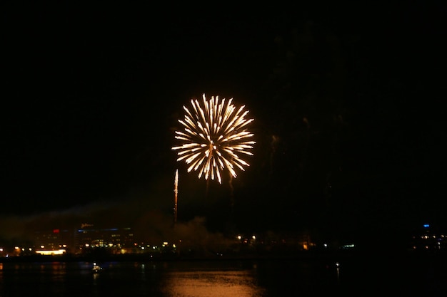 Lively multi-colored fireworks on black background