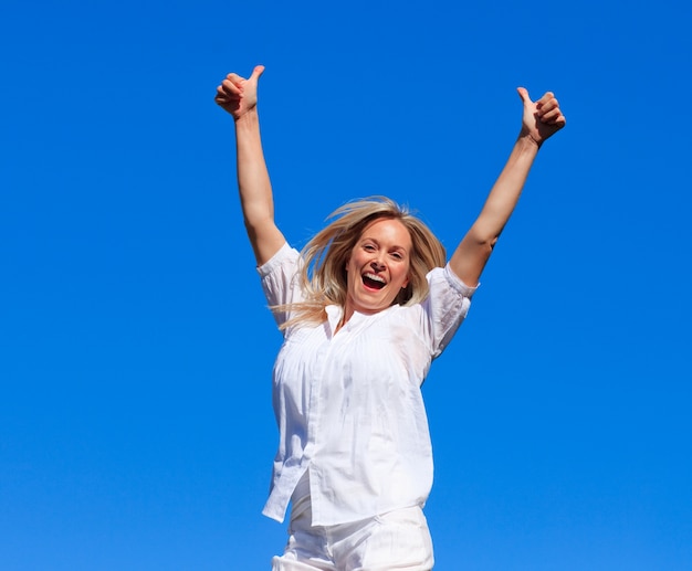 Lively woman jumping in the air