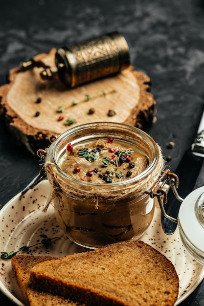 Liver pate homemade chicken liver pate in a glass jar Haute cuisine vertical image top view place for text