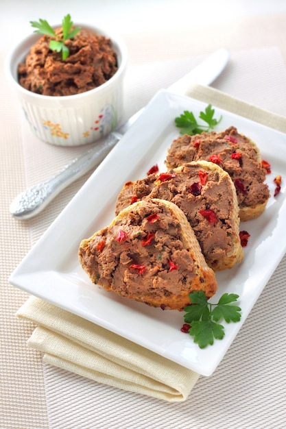 Liver pate with paprika on slices of wholegrain bread