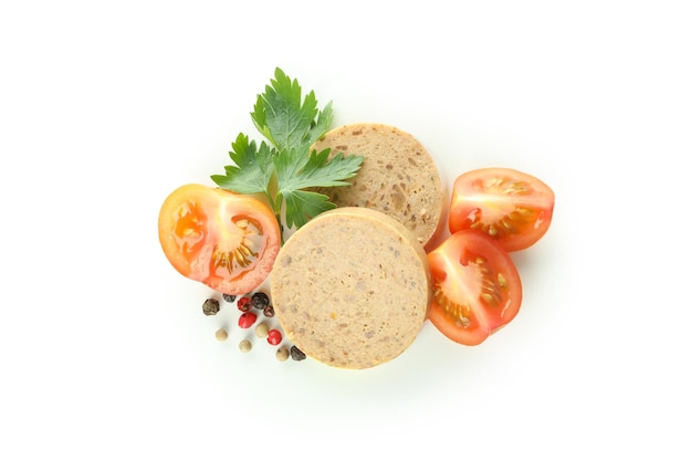 Liverwurst slices tomato pepper and parsley isolated on white background