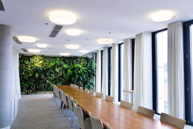 Photo living green wall vertical garden indoors with flowers and plants under artificial lighting in meeting boardroom modern office building