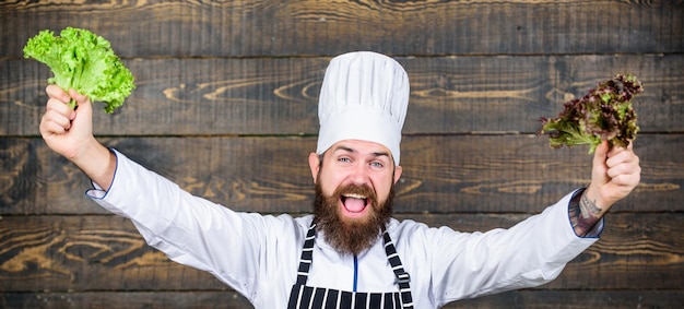 Living a healthy life Dieting organic food Healthy food cooking Mature hipster with beard Cuisine culinary Vitamin Vegetarian salad with fresh vegetables Happy bearded man chef recipe