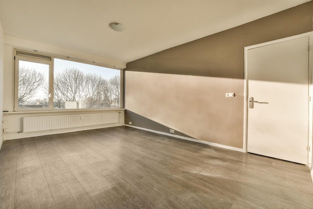 The living room of an empty house with a door