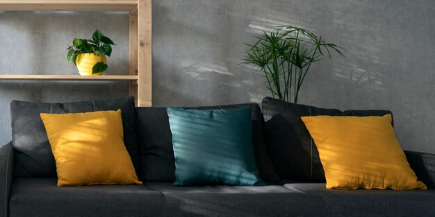 Living room in gray colors with bright accents. Cozy modern interior. Modern guest room or office reception area.