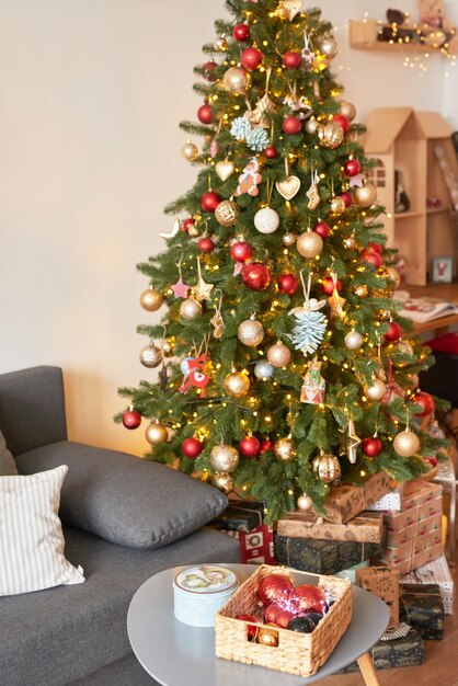 Living room interior Christmas tree and wreath New Year celebration Vacation rentals Winter holidays and vacations