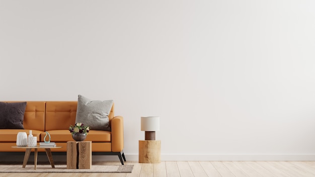 Living room interior wall  in warm tones with leather sofa on white wall .3d rendering