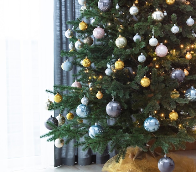 Living room interior with Christmas tree and decorations.