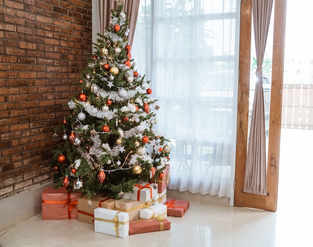 Living room interior with Christmas tree and gift boxes