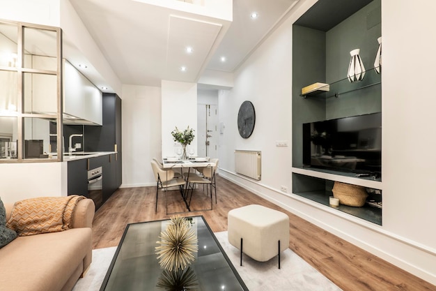 Living room and kitchen dining area of a vacation rental apartment with contemporary decor