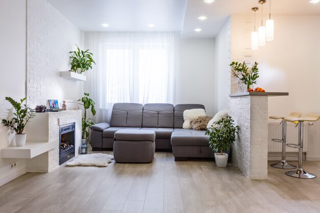 living room with big window and brown wall interior