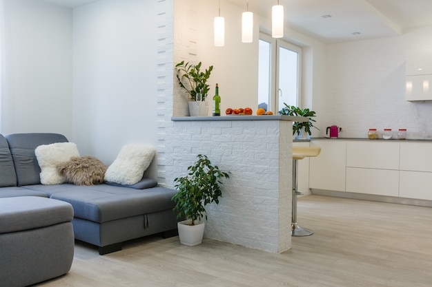 living room with big window and brown wall interior