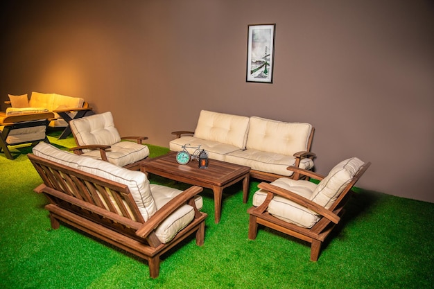 A living room with a couch and chairs and a coffee table.