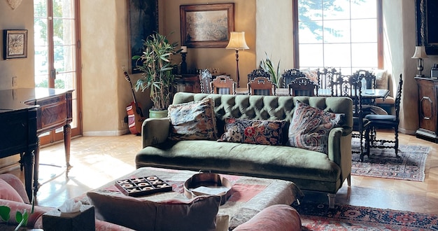 a living room with a couch and a lamp on the wall