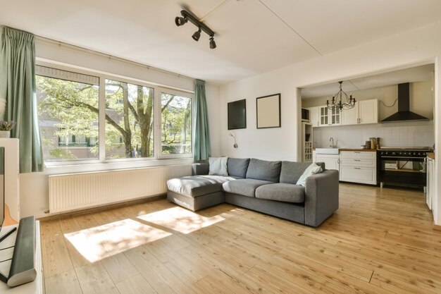 a living room with a couch and a large window