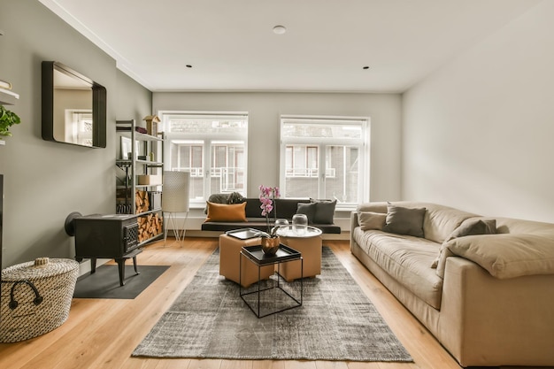 Photo a living room with couches coffee table and tv on the wall in it's centerpiece