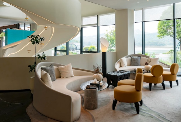 A living room with a large window that has a view of the lake.