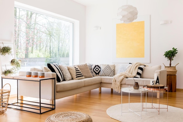 A living room with a large yellow painting on the wall