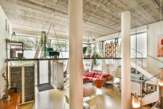 A living room with lofted ceilings and a staircase