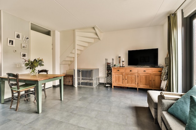 A living room with a table and a tv