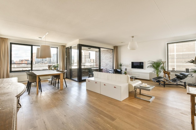 A living room with a white couch and a table