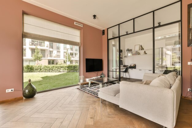 a living room with a white couch and a tv