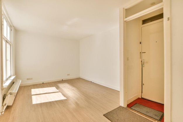 A living room with wood floors and a door