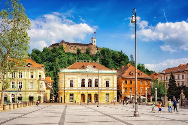 Ljubljana, Slovenia - April 28, 2018: Academia Philarmonic on Congress square and Old castle on Castle hill in the historical center of Ljubljana, Slovenia