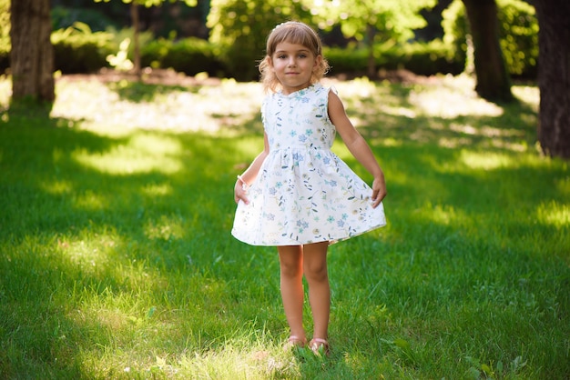 Llittle girl child outdoor in summer day.