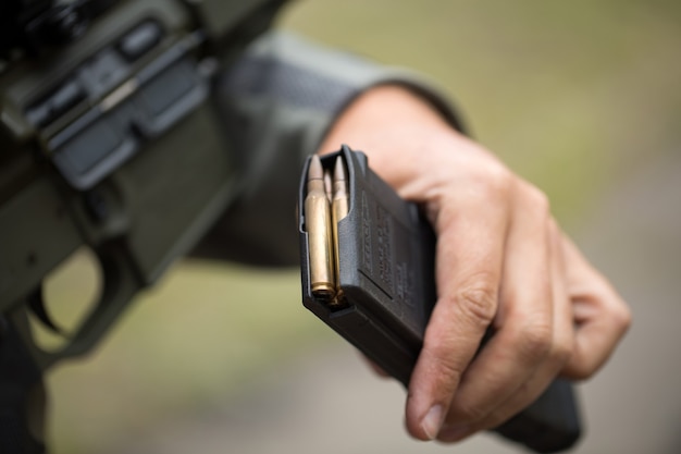 Loading ammunition into a clip. Reloading weapons