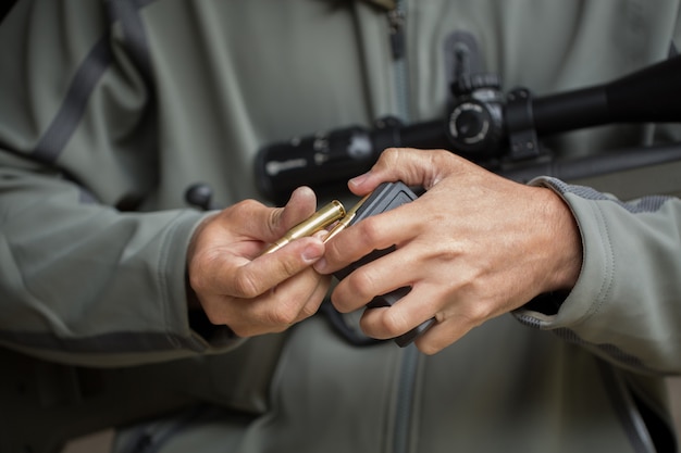 Loading ammunition into a clip. Reloading weapons