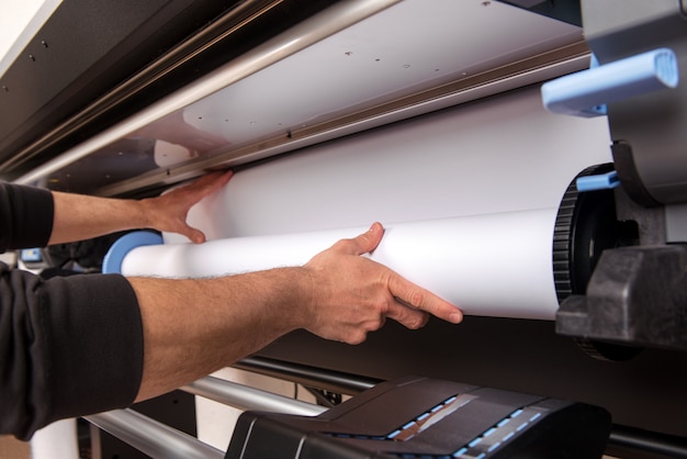 Loading roll of paper on printer