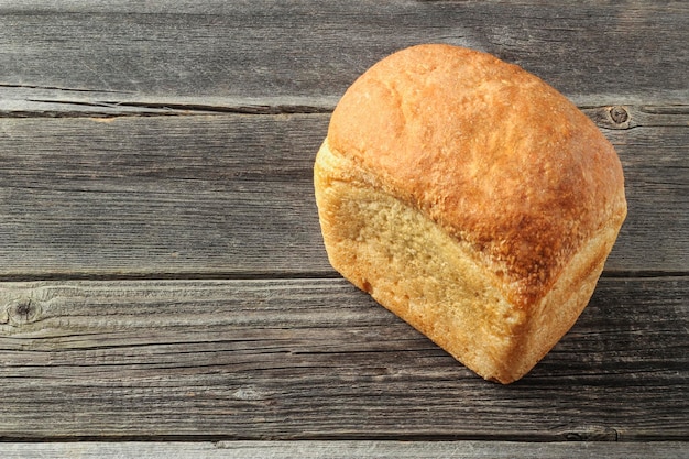 A loaf of bread on a wooden table